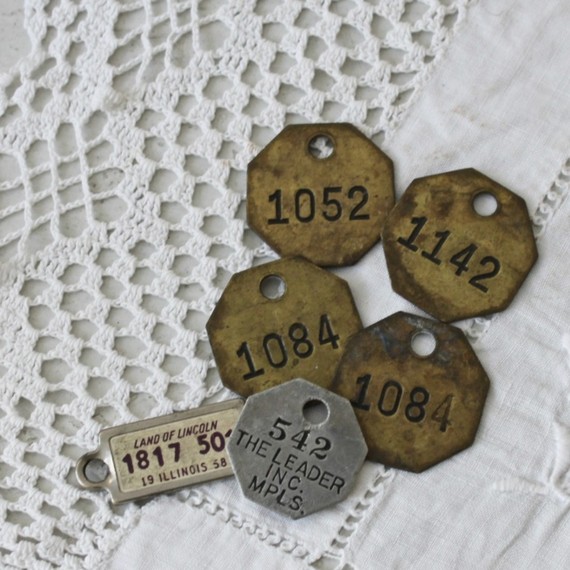 old metal numbered tags