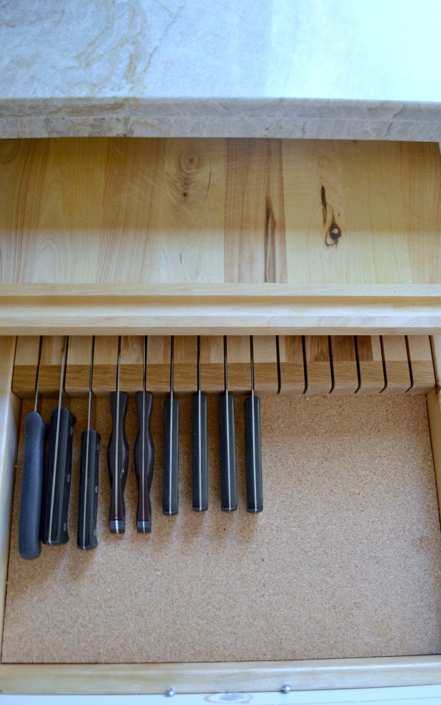 Double tiered knife drawer with cutting board