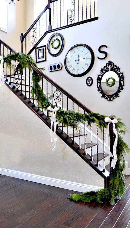 Beautiful fresh garland going up the stair rails for Christmas, so pretty!