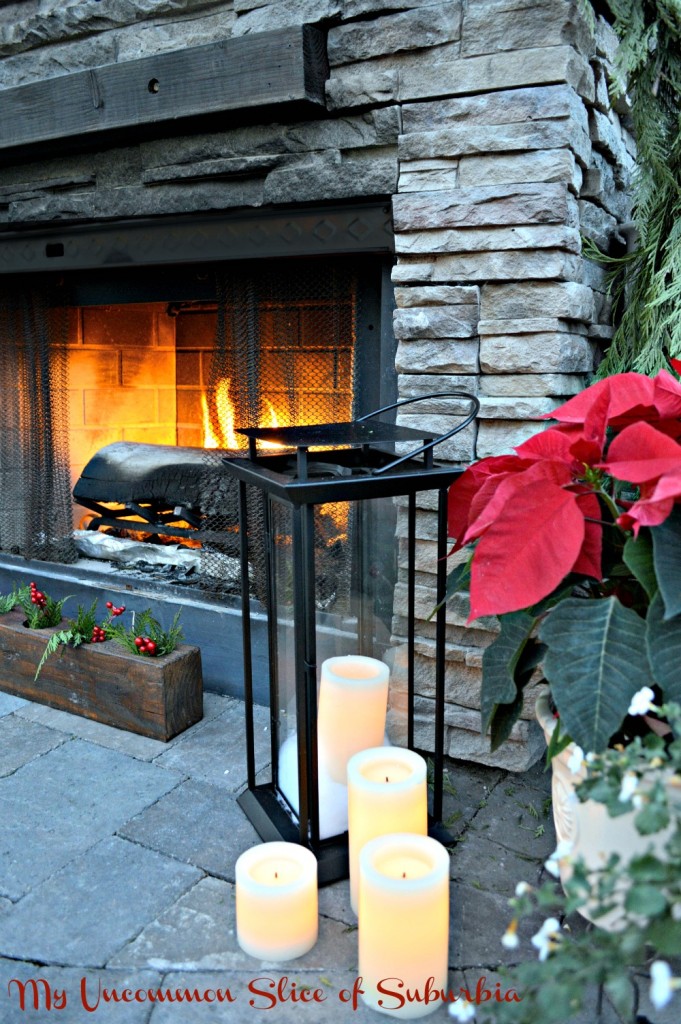 Stacked Stone Outdoor Fireplace with Lanterns and Candles