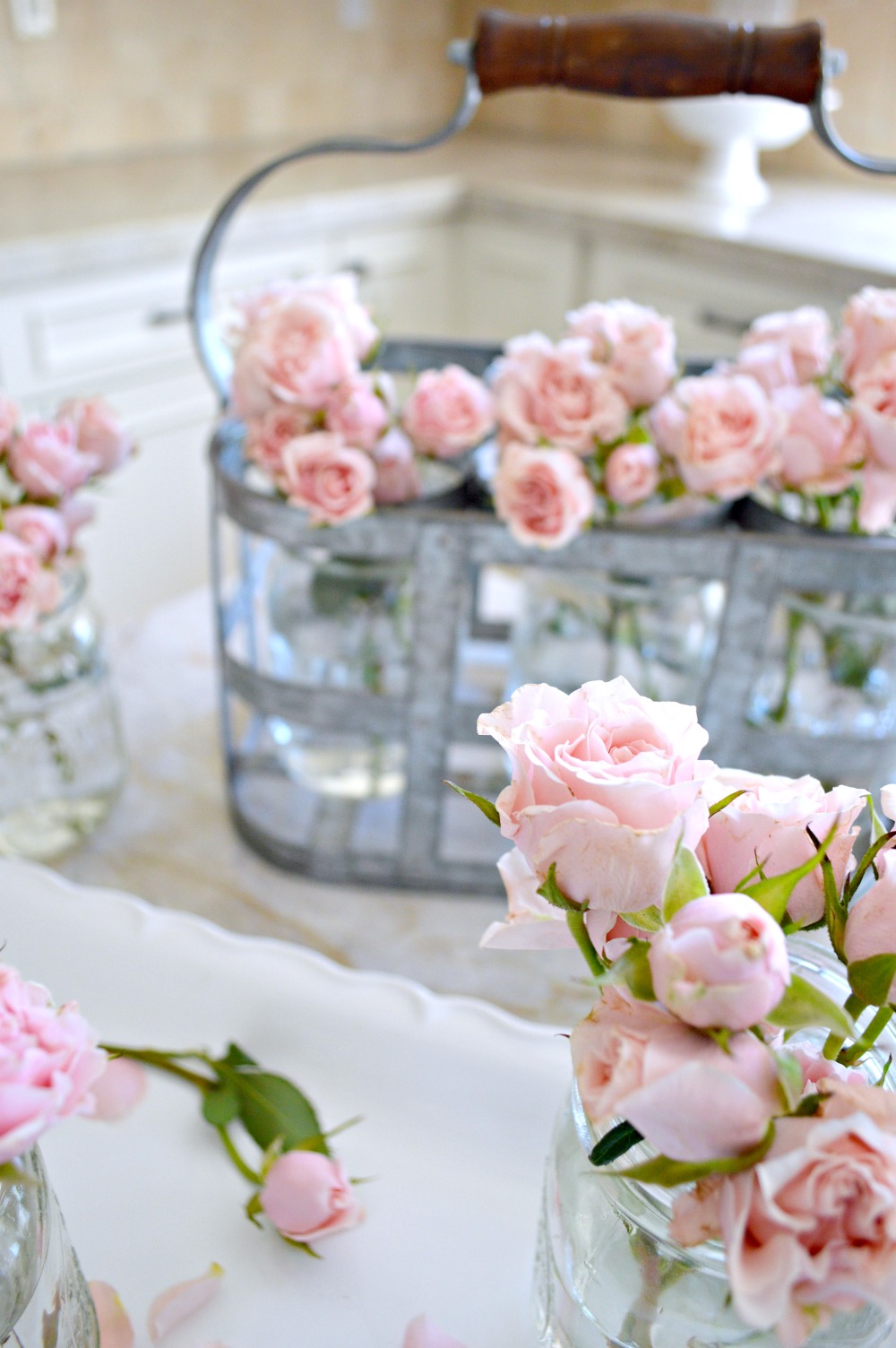 delicate roses displayed in a vintage caddy, so pretty