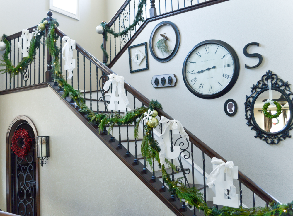 staircase-dressed-for-christmas-in-a-mix-of-fresh-garlands