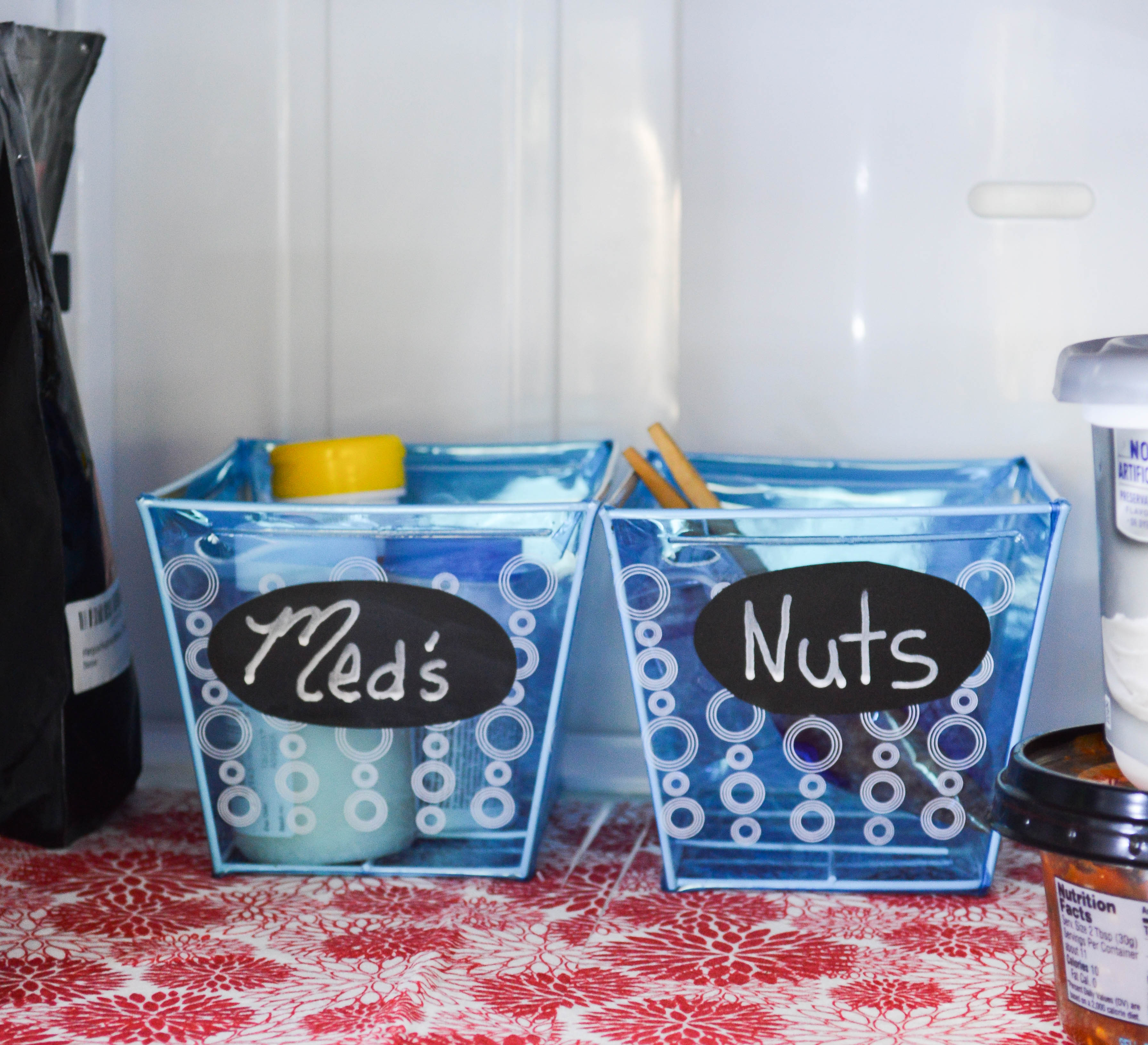 Use bins in the refrigerator to maximize storage space and make it easy on the kids to grab snacks.