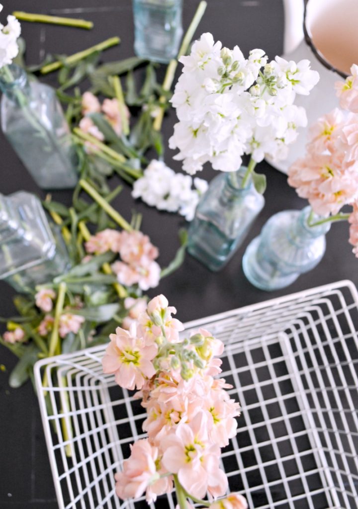 Take freshly cut stems and insert them into glass bottles for a gorgeous display!