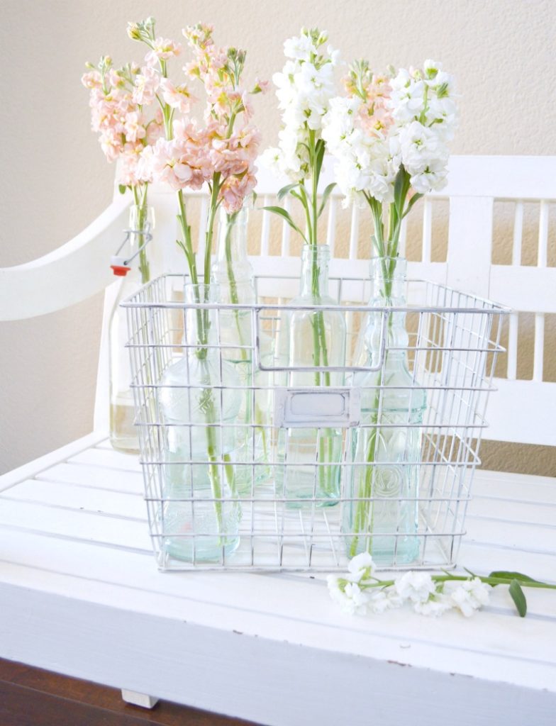 Take freshly cut stems and insert them into glass bottles for a gorgeous display!