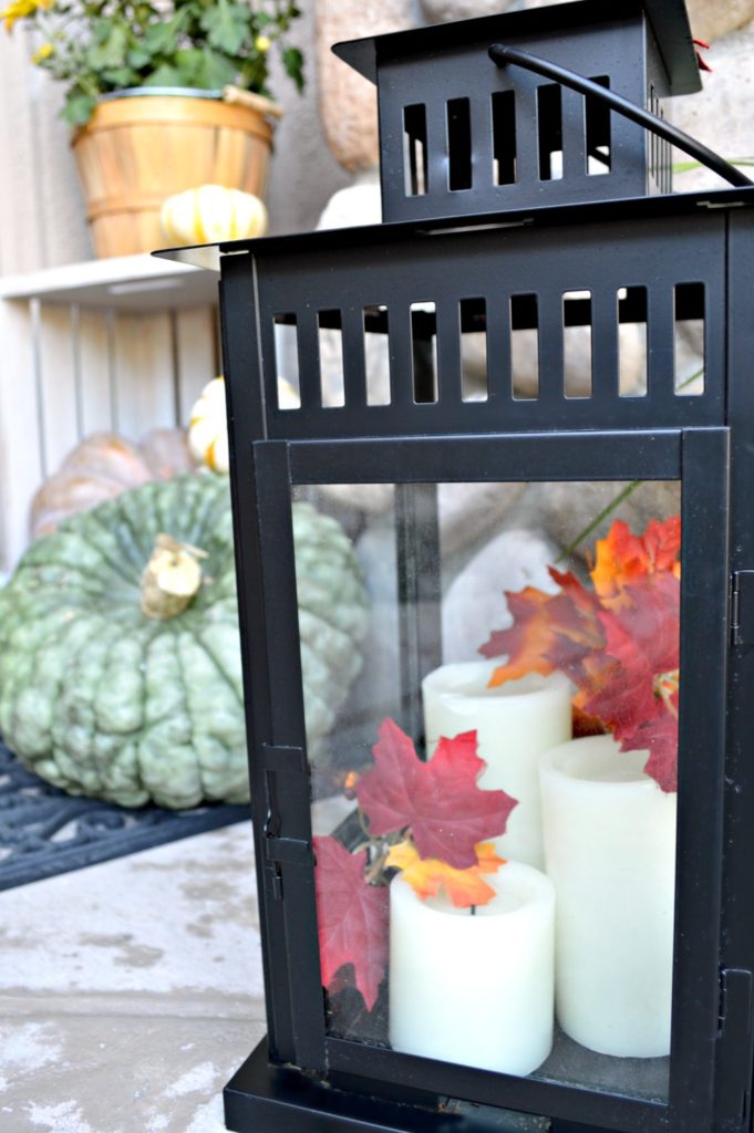 grab those lanterns laying around , add some candles and gourds and you are set for fall!