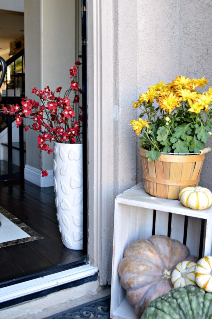 small front porch decorated for fall