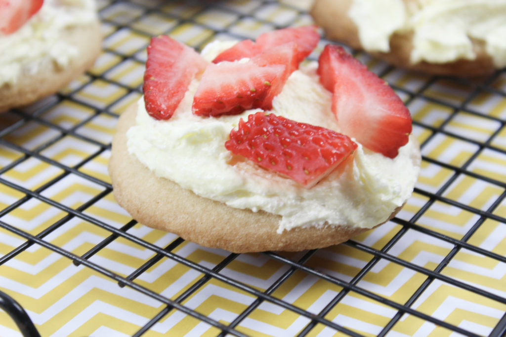 *Directions* - In a large bowl, combine the frozen whipped topping and lemon curd until it's completely mixed. - Use a spoon to scoop a small amount on top of the sugar cookies and spread it so the top is completely covered. - Top with chopped strawberries. - Serve immediately or chill in fridge until ready to serve.