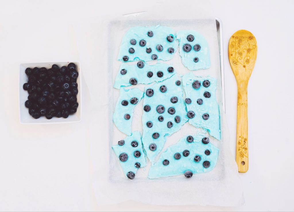 this Make Ahead Blueberry Greek Yogurt Bark is a 2-ingredient treat you can take with you or munch on when you need a quick snack! Full of protein and probiotics!