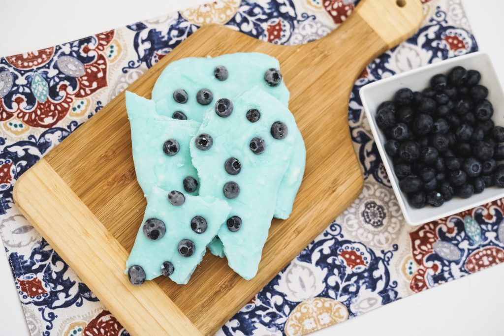 this Make Ahead Blueberry Greek Yogurt Bark is a 2-ingredient treat you can take with you or munch on when you need a quick snack! Full of protein and probiotics!