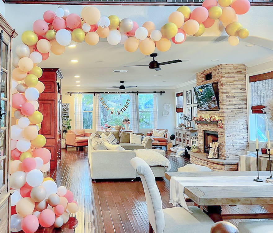 Hang balloons on ceiling using fishing wire to give the look of